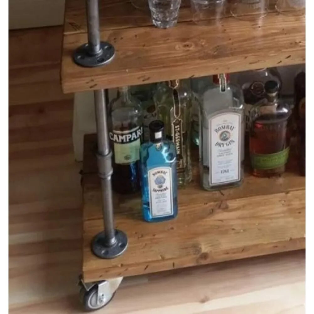 Liquor bottles on bottom shelf of bar cart