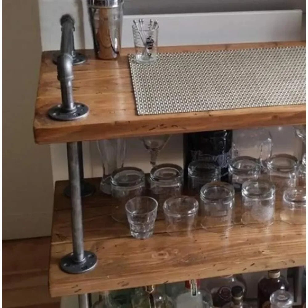 Detail of left corner of bar cart with pipe leg and wheel