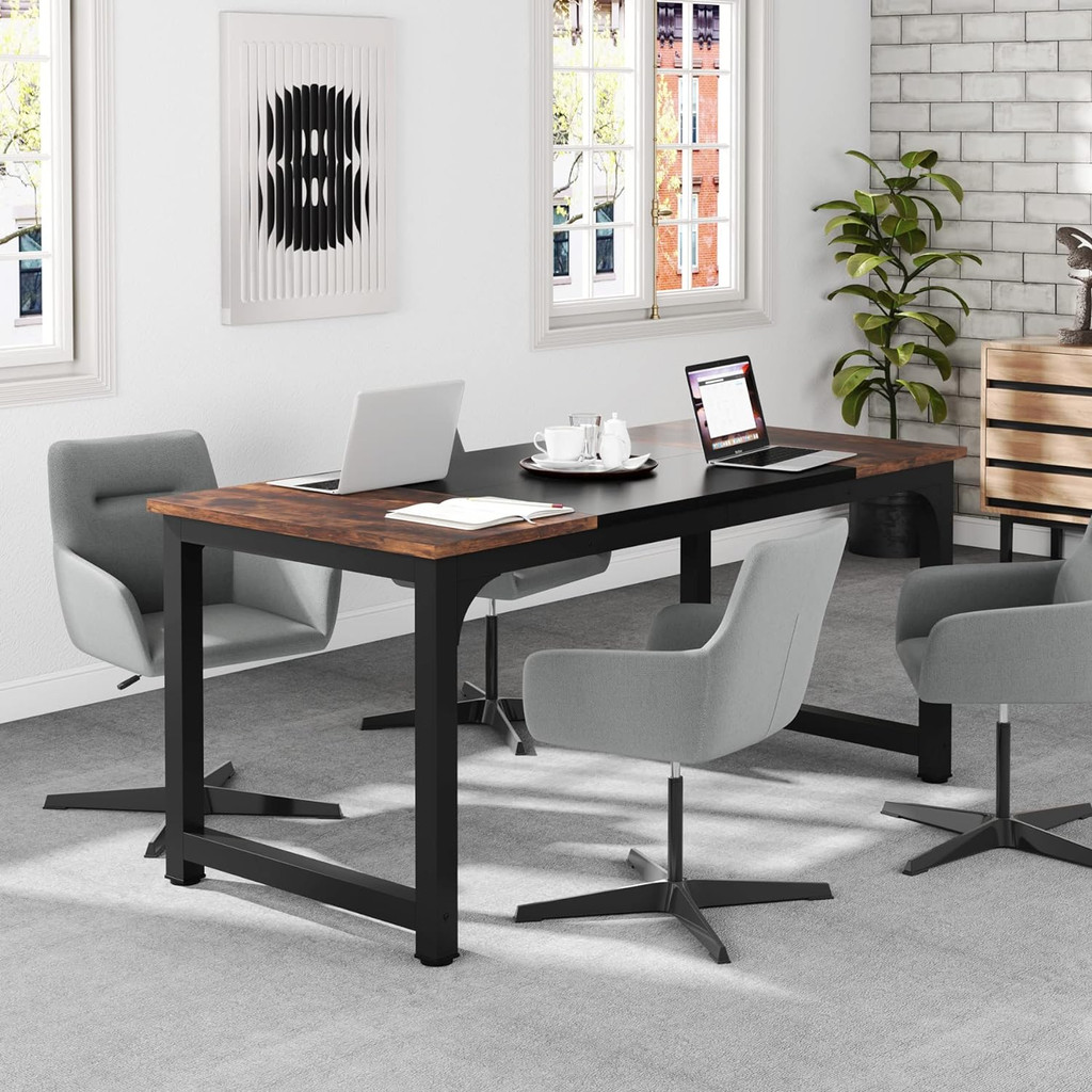 Office desk with dark wood top and grey chairs in a modern room