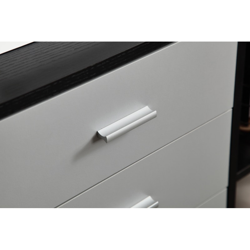 Close-up of drawer handle on white drawer front of wooden file cabinet