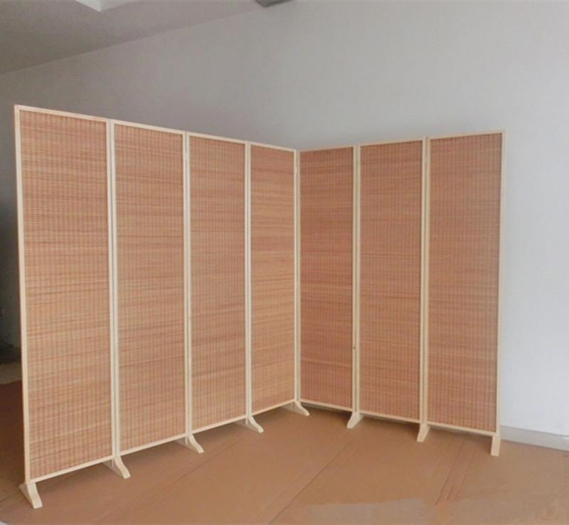 Seven-panel bamboo room divider set up in corner