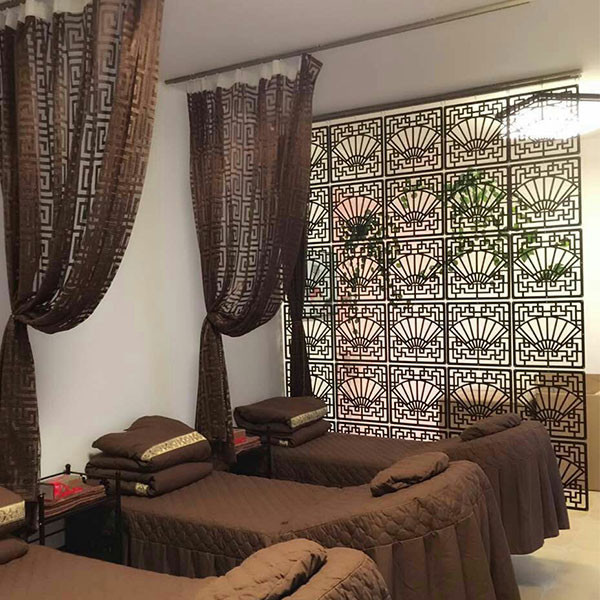 Decorative fan-pattern room dividers in a spa or salon
