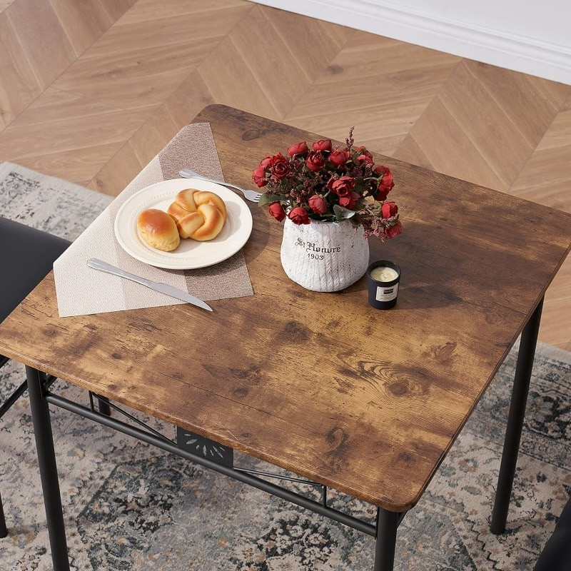 top of dining table with plate and flowers