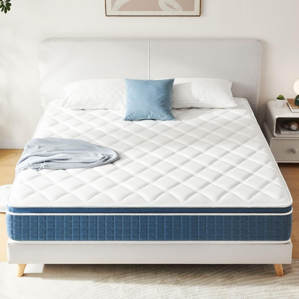 White quilted mattress and blue edge on bed