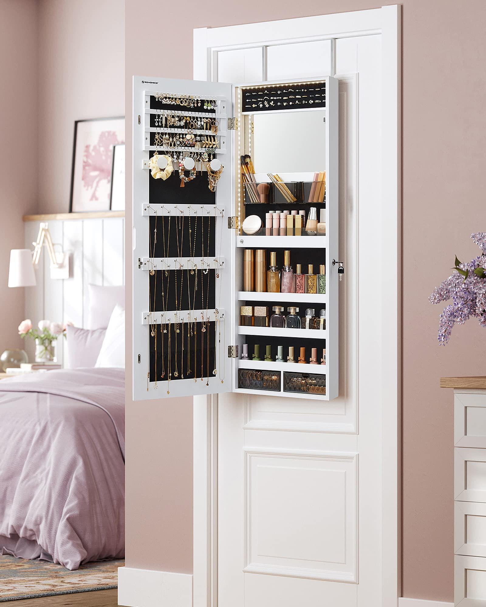 White mirror jewelry cabinet armoire open on wall with LED-lit mirror and organized storage