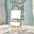 15"L x 25.5"W x 56.5"H Metal Scroll Extra Large Free Standing Adjustable Display Stand Easel with Chain Support, Heavy Duty Easel for Sign, Wedding, Picture Frame, Mirror, Gold (No Assembly Required)