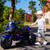 12V Electric Kids Motorcycle for 3-8 Year Old Boys Girls, 3-Wheel Ride-On Toy Motorbike with Lighting Wheels, Music Player (Connect with Phone) and Hand Drive (Blue)