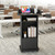 Qriocioa Podium Stand with Metal Wheels Wooden Lectern Podium Stand Portable Pulpit Standing with Storage Mobile Reception Podiums Desk for Church Office School Conference Restaurant Meeting, Black
