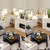 Vintage Chandelier in Brushed Gold Finish with Flower-Shaped White Glass Shades and Hanging Crystal Accents