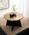 Modern Round Hammered Metal Coffee Table, 28 x 28 x 18, Antique Brass and Black, Transitional Circle Living Room Table with Angled Mango Wood Base