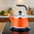 Stainless Steel Orange Whistling Tea Kettle - 2.1 Quart Stovetop Teapot with Loud Whistle, Food Grade, Perfect for Tea, Coffee & Milk - Stylish Kitchen Essential