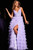 The JVN37001 prom dress, part of the formal collection, is a stunning and romantic gown designed to make a lasting impression at any formal event. This dress combines the softness of tulle with the delicate beauty of lace to create a truly enchanting look.

The style of this dress is a classic ballgown, characterized by its full and voluminous skirt. The layered skirt features a high slit, adding a modern twist to the traditional ballgown silhouette. This high slit allows for ease of movement and adds a touch of allure to the overall design. At the high waist, there is an embellished belt, which cinches the waist and adds a touch of sparkle, creating a flattering focal point.

The bodice of the dress is adorned with lace, adding a touch of romance and sophistication. The lace detailing continues over the straps that elegantly drape over the shoulders, creating a V-neckline that is both graceful and flattering. The back of the dress is open, adding an element of allure and showcasing the lace detailing.