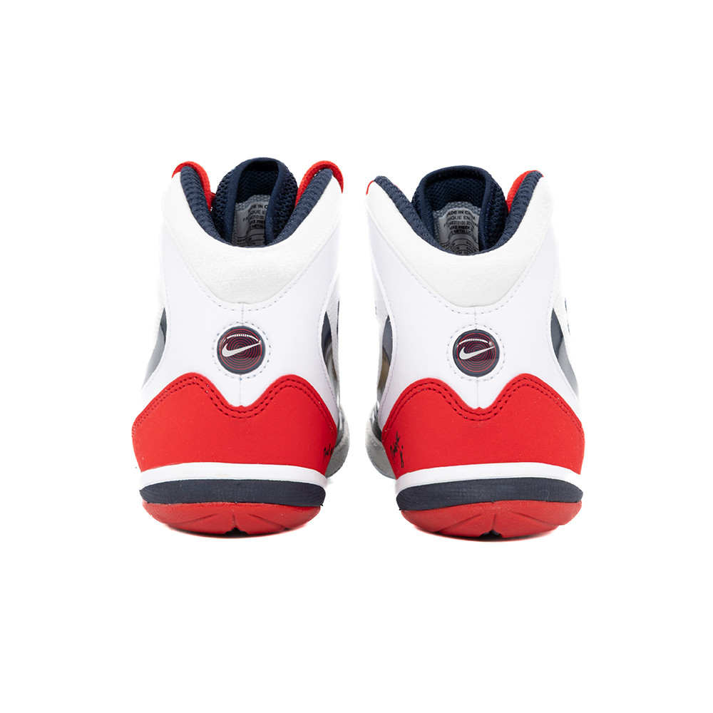 white and red nike freeks