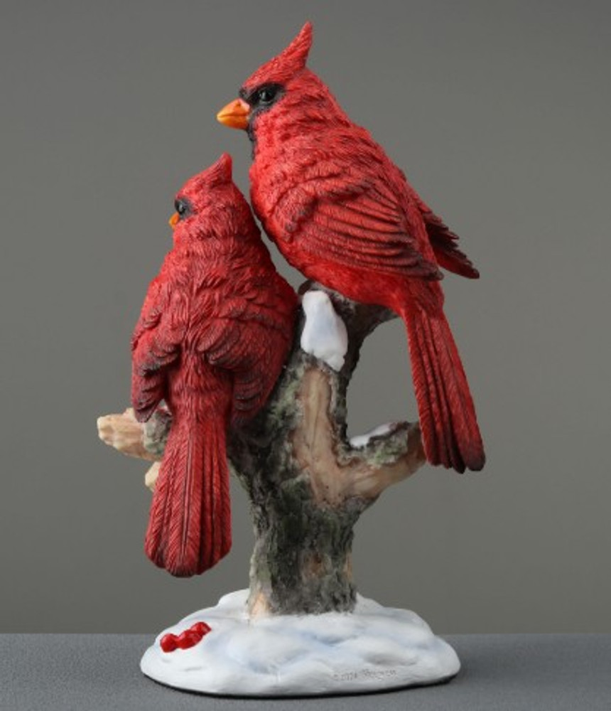 Cardinal Pair Perching on Snowy Branch
