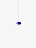 A cobalt blue Flowerpot VP10 pendant lamp hangs from a same-colored cord against a white background, featuring a domed outer shade and a smaller inner shade.