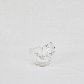 Clear glass bowl made of recycled glass on a white background