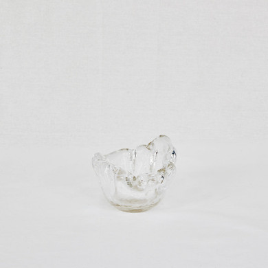 Clear glass bowl made of recycled glass on a white background