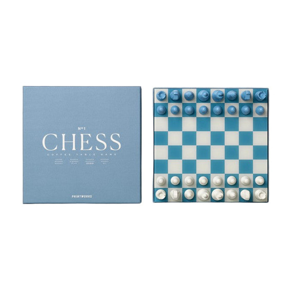Blue and white chess set with packaging on a white background