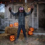 Morris Animated Light-Up 6 Ft. Jack & Jill Zombie Halloween Decoration, spooky zombie figure with glowing eyes and mouth, in front of a haunted house with illuminated jack-o'-lanterns, Halloween porch decor.