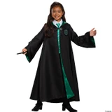 Disguise Harry Potter Slytherin Robe Prestige - Child, a young girl wearing a black Slytherin robe with green lining and crest, smiling and holding a wand.