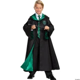 Disguise Harry Potter Slytherin Robe Prestige - Child, a young boy dressed in a Harry Potter Slytherin costume including a black robe with green lining, a Slytherin crest, a white shirt, green striped tie, and holding a wand.