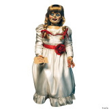 Trick or Treat Studios Annabelle Prop - Annabelle, a creepy animated doll with a vintage white dress, braided hair with red ribbons, holding a "Miss Me?" sign, and featuring cracked skin and unsettling eyes.
