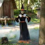 Seasonal Visions 7' Animated Whimsical Witch, a tall witch figure with a creepy face, black dress with orange accents, and a pointed hat, standing in a spooky forest setting