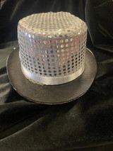 Fantasy Costumes Sequin Top Hat - Silver, Silver metallic top hat with perforated design and a white ribbon band, perfect for costumes and parties.