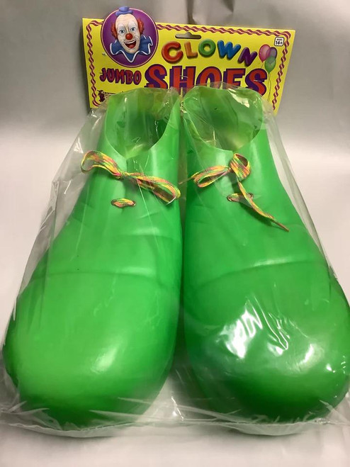 Rubies Clown Shoes Child Sized - Green, brightly colored clown shoes in green with multicolored laces, packaged in clear plastic with clown-themed packaging in the background.