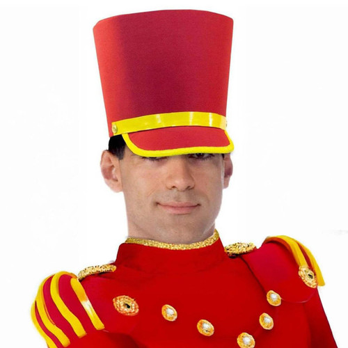 Rubies Toy Soldier Hat- Deluxe, a tall red toy soldier cap with yellow trim worn by a man in a red uniform with gold decorative buttons and shoulder epaulets.