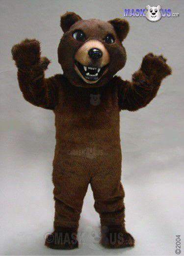 Mask US Brown Grizzly Mascot Costume, a plush brown bear mascot with a friendly face, large eyes, and wearing a necklace, standing with arms raised.