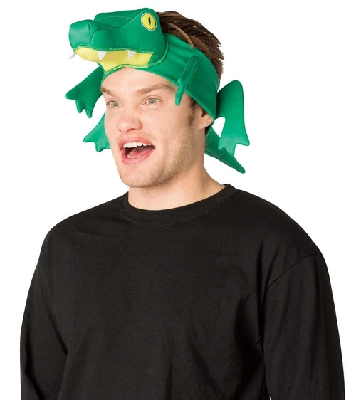 Rasta Imposta Alligator Headband, a green plush crocodile headband with detailed features, worn on a young man's head as a fun costume accessory.