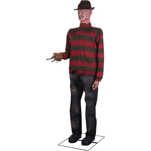 Gemmy Freddy Krueger Life-Size Animatronic, life-sized Freddy Krueger figure with a burned, scarred face, wearing a striped red and black sweater, distressed jeans, brown fedora hat, and glove with blades on the fingers.