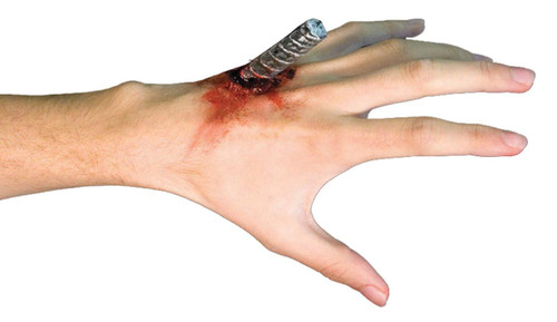 Woochie Kit Impaled, realistic special effects prosthetic attached to a person's hand showing a bloody impaled wound with a metallic stake.