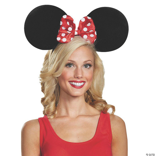 Disguise Minnie Mouse Ears Oversized, woman wearing large Minnie Mouse ears headband with red polka dot bow.
