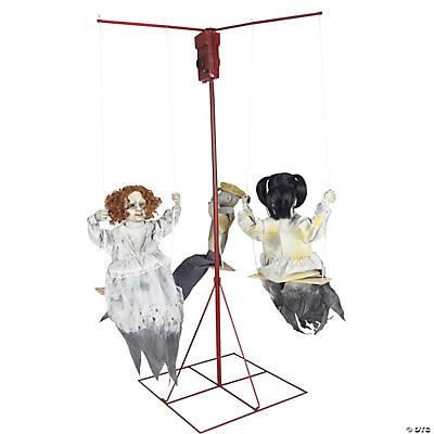 Seasonal Visions Ghostly Go Rounds Animated Prop, a spooky animated hanging ghost carousel with three ghost figures riding swings on a red stand.