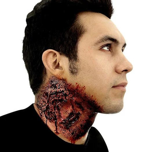 Woochie Mega Bite Woochie Appliance, realistic wound prosthetic applied to a man's neck showing a severe bite mark and torn flesh for special effects or costume makeup.
