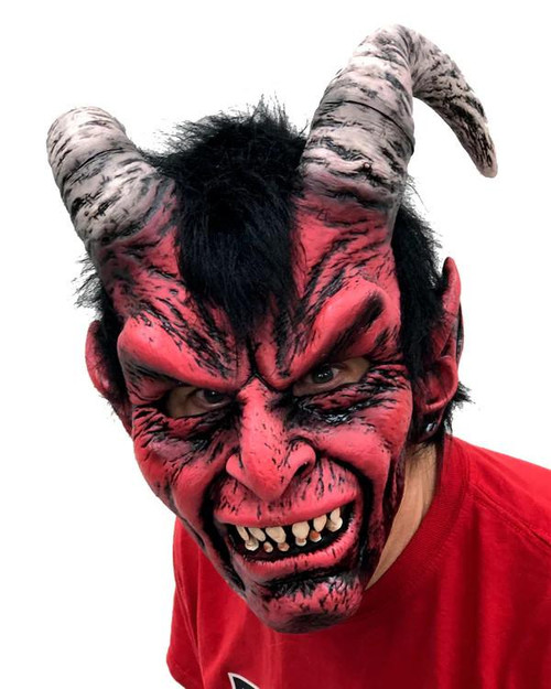 Zagone Diablo, Devil/Krampus Mask, detailed demonic face mask with horns, exaggerated facial features, and realistic skin texture, worn by a person with a fierce expression.