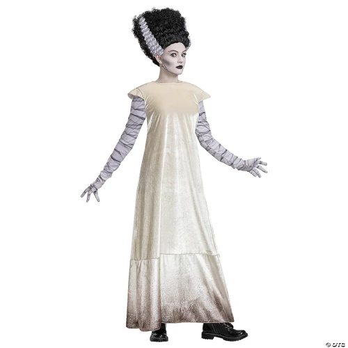 Disguise Bride of Frankenstein Deluxe Costume - Adult, a woman wearing a long, shiny, cream-colored dress with the iconic Frankenstein bride hairstyle and makeup, and black shoes.