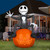 Gemmy 10 Ft. Blow-Up Inflatable Lightshow Nightmare Before Christmas Jack Skellington with Built-In LED Lights, large Halloween decoration featuring Jack Skellington sitting on a glowing pumpkin with LED-lit face, set in front of a house at dusk.