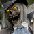 Seasonal Visions 8' 6" Animated Graveyard Host, a spooky Halloween decoration featuring a skeleton with ghostly white hair wearing a black hat, a gray bow tie, and a dark cape, with glowing yellow eyes and an open mouth showing sharp teeth.