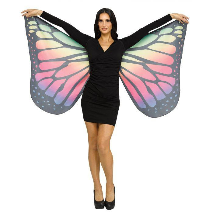 Fun World Wings Soft Butterfly Rainbow Adult, a woman wearing butterfly wings costume with colorful rainbow patterns on black wings in a butterfly pose.