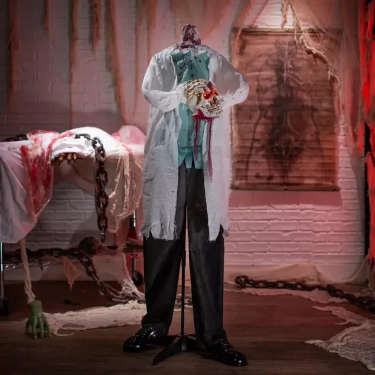 Product A Holiday Company Animated Light-Up 5 Ft. 2" Standing Shaking Headless Skeleton Doctor Halloween Decoration, spooky haunted hospital scene with chains, blood-stained sheet, and eerie background.