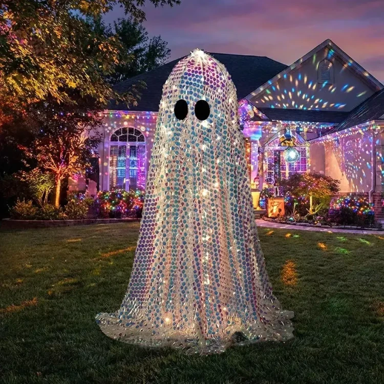 Morris Tall Disco Mosaic Ghost Halloween Decoration -46 1/2 inches, illuminated ghost Halloween yard ornament with mosaic design and black eyes, set against a decorated house and yard at dusk.