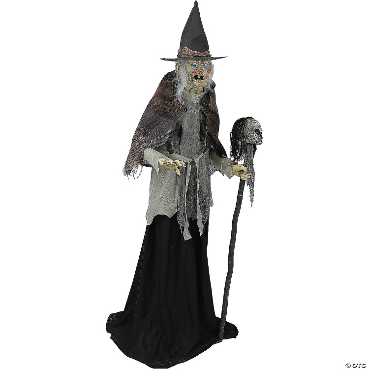 Seasonal Visions 6' Lunging Witch With DigitEye Animated Prop, a Halloween decoration featuring a spooky witch figure with tattered clothing, a pointed hat, and a staff with a skull, designed for entertaining and frightening during the spooky season.