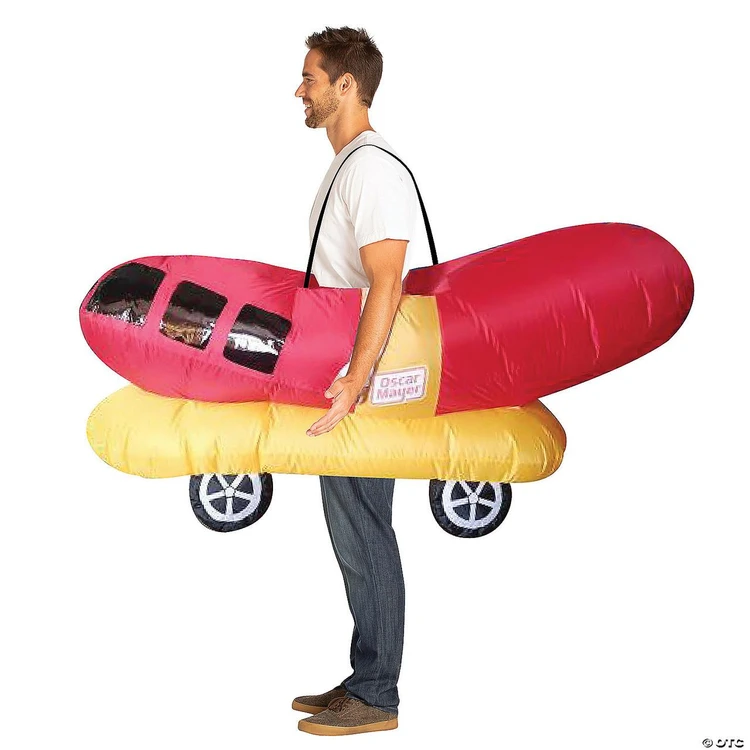 Rasta Imposta Oscar Mayer Inflatable Wiener Mobile Costume - Adult, a person wearing a large inflatable hot dog costume resembling the Oscar Mayer Wiener Mobile, with wheels and bun details.