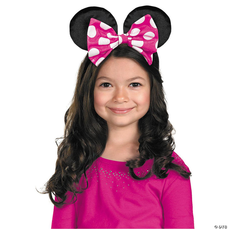 Disguise Minnie Mouse Ears With Reversible Bow, girl wearing black Minnie Mouse ears headband with pink polka dot bow, smiling