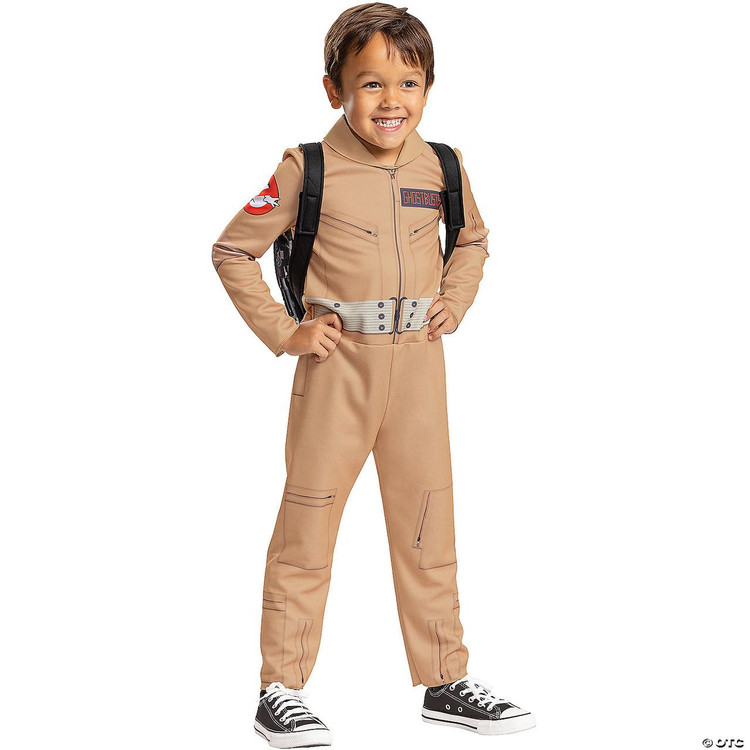 Disguise Ghostbusters Toddler Costume 3T-4T, child dressed in a Ghostbusters-themed jumpsuit with beige color, features a zipper front, patches, and a belt detail, worn by a smiling young boy with a backpack and sneakers.