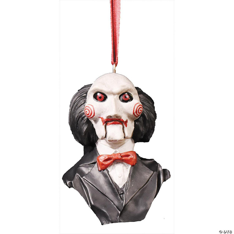 Trick or Treat Studios Billy Puppet Ornament - SAW, horror movie character ornament with white face, red spiral cheeks, black hair, black suit, and red bow tie hanging on a red ribbon.
