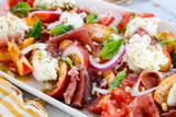 Peach and Tomato Caprese Salad with Pine Nuts, Prosciutto, and Tarragon Oil